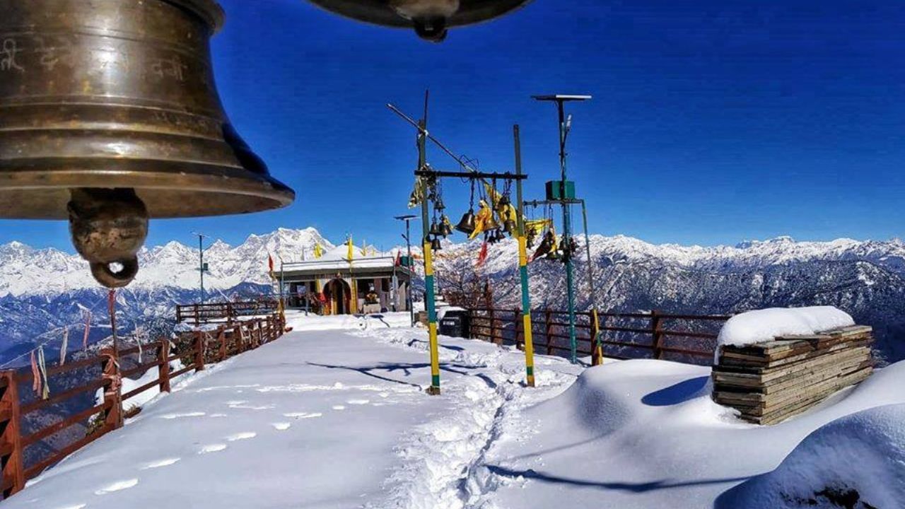 Snow-covered Kartik Swami Temple in winter season showing typical weather and temperature